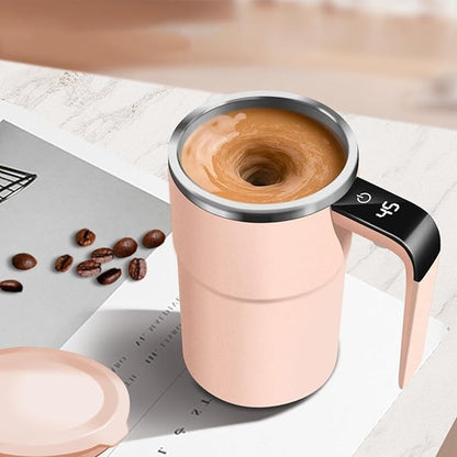 Pink travel mug with coffee on a table with coffee beans